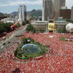 Crowds dressed in red filling Seoul Plaza to cheer for Korea during the 2002 FIFA World Cup